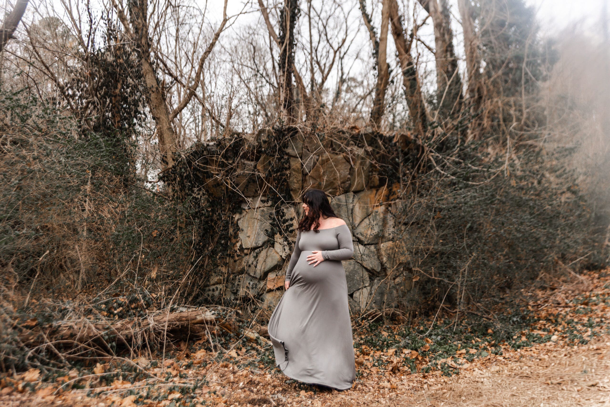 maternity session pony pasture richmond va winter. expecting woman standing in nature.